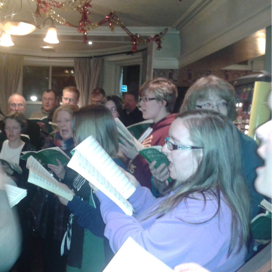 An image of me singing with my church choir during the festive season back in 2014